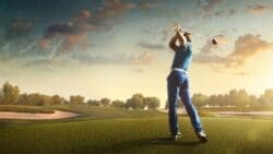 Man golfing with a blue sky background.
