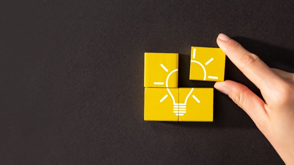 How New Products Partnerships and Collaborations Drive Growth - Yellow light bulb blocks