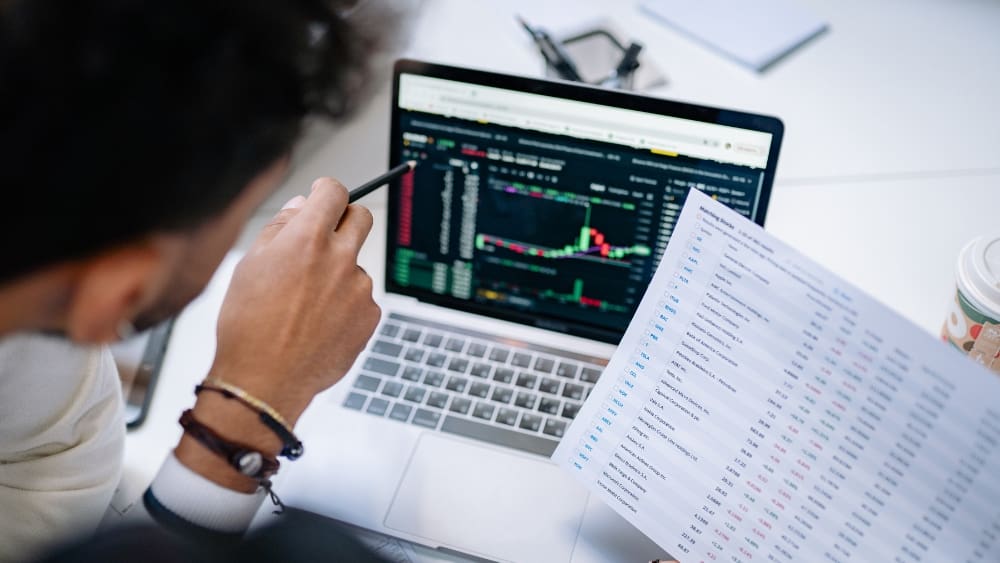 Why Your PPC Lead Generation Needs a Better Finish Line - Man looking at data on laptop